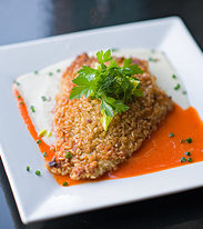 Brown rice encrusted halibut with red pepper sauce and cauliflower puree