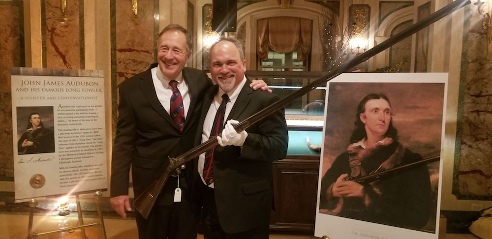 Paul Buttner holding John James Audubon’s “Long Tom” rifle