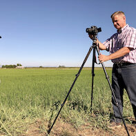 Jim profile photo- field with Josh Sheppard 71019
