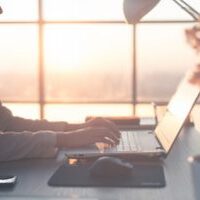 Adult businesswoman working at home using computer, studying business ideas on a pc screen on-line